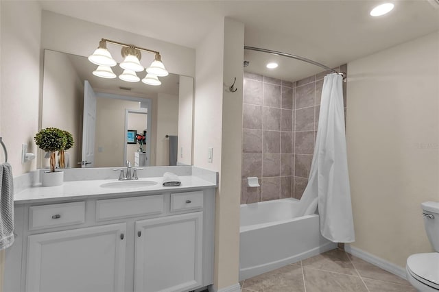 full bathroom featuring shower / tub combo, vanity, toilet, and tile patterned flooring