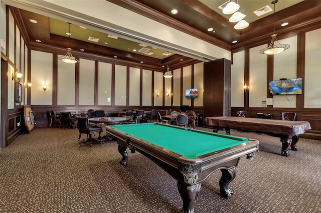 rec room with a tray ceiling, billiards, and dark colored carpet