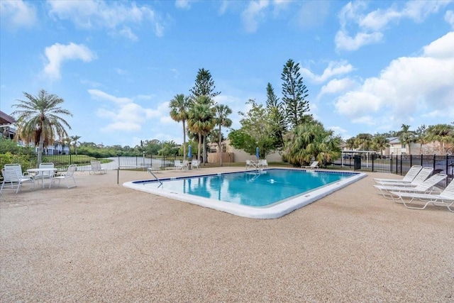 view of swimming pool with a patio