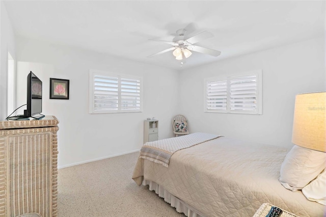 bedroom with light carpet and ceiling fan