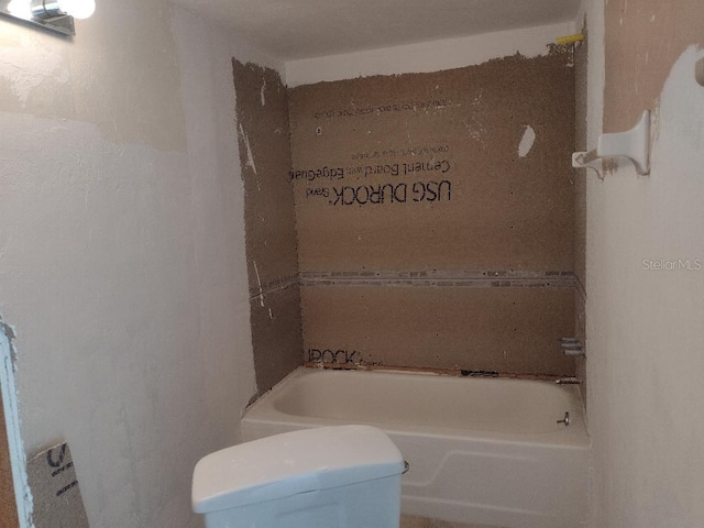1801 Gulf Dr N Unit 121, Bradenton Beach, FL 34217 - bathroom featuring toilet and a bath