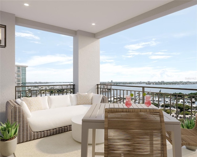 balcony with a water view and an outdoor hangout area