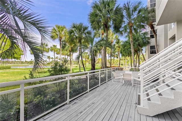 wooden terrace with a water view