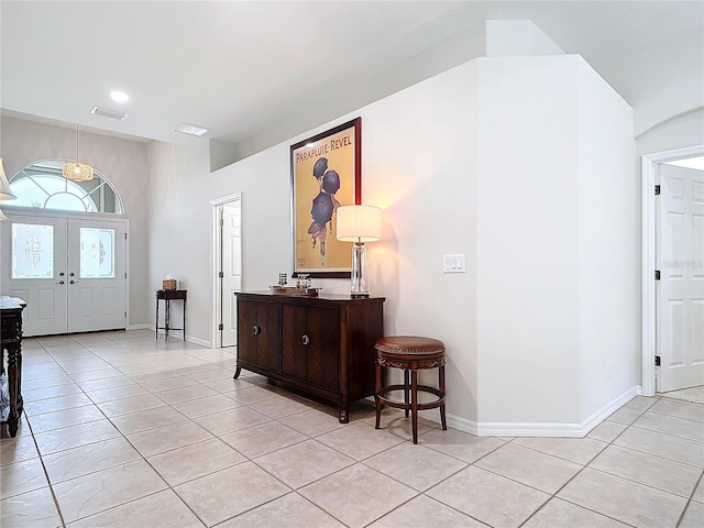 tiled foyer with french doors