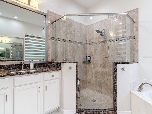 bathroom with vanity and plus walk in shower