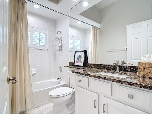 full bathroom featuring shower / bath combination with curtain, tile patterned floors, toilet, and vanity