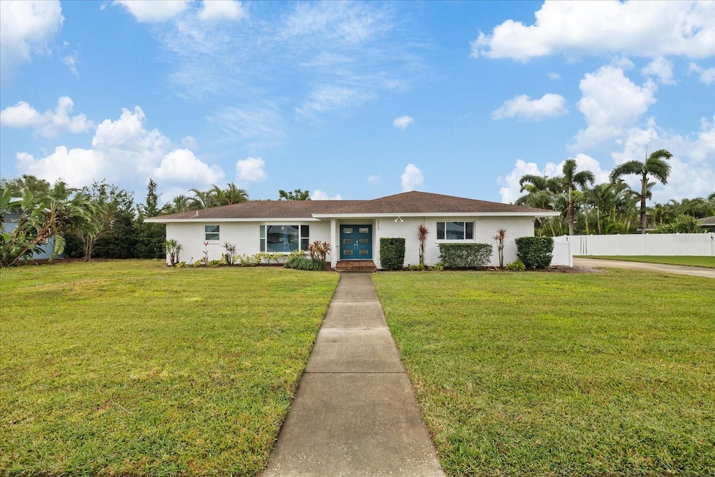 ranch-style house with a front lawn