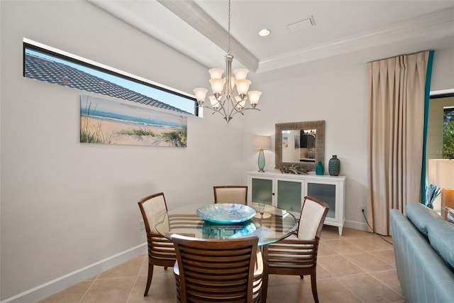 tiled dining space featuring an inviting chandelier and ornamental molding