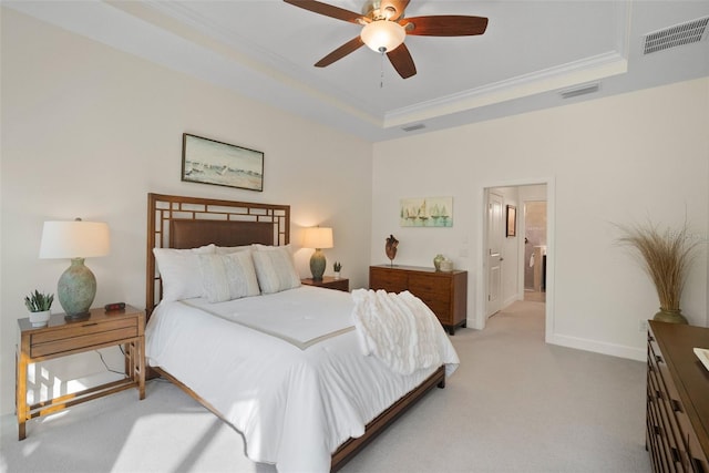 bedroom featuring a raised ceiling, crown molding, light colored carpet, and ceiling fan