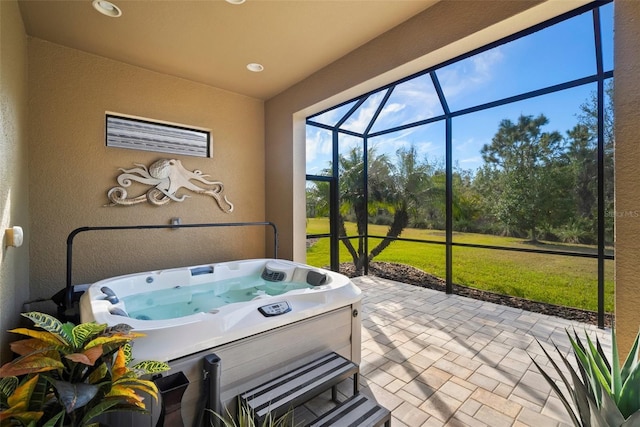 sunroom with a hot tub