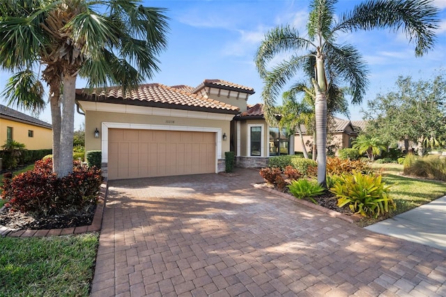 mediterranean / spanish house featuring a garage