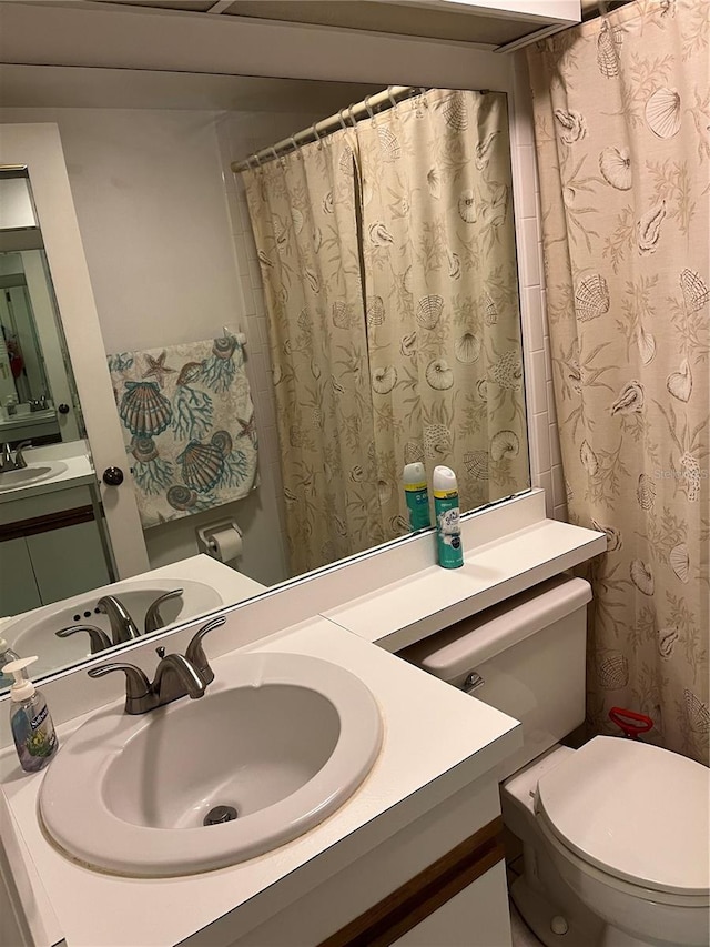 bathroom featuring sink and toilet