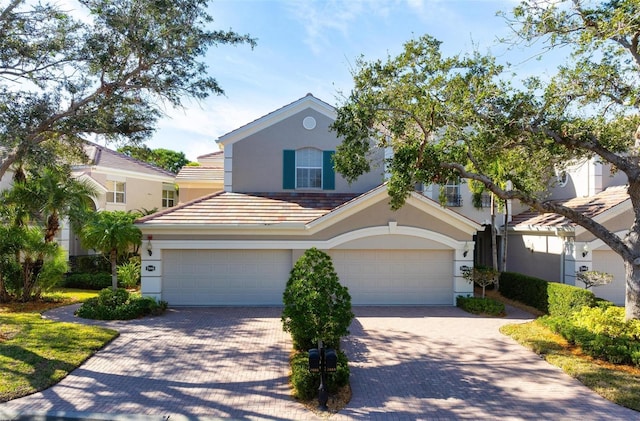 view of front of property with a garage