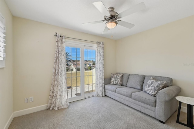 living room with ceiling fan and carpet floors