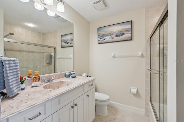 full bathroom with shower / bath combination with glass door, tile patterned floors, toilet, and vanity