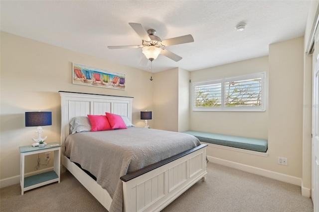 bedroom with light colored carpet and ceiling fan