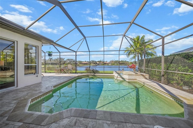 view of pool with a patio area, an in ground hot tub, a water view, and glass enclosure