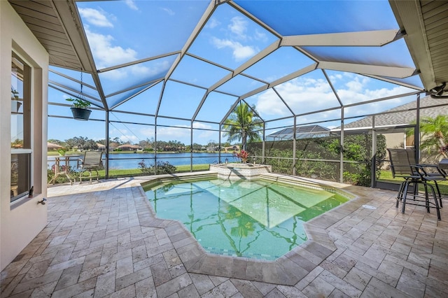 view of swimming pool featuring a water view, an in ground hot tub, a lanai, and a patio area