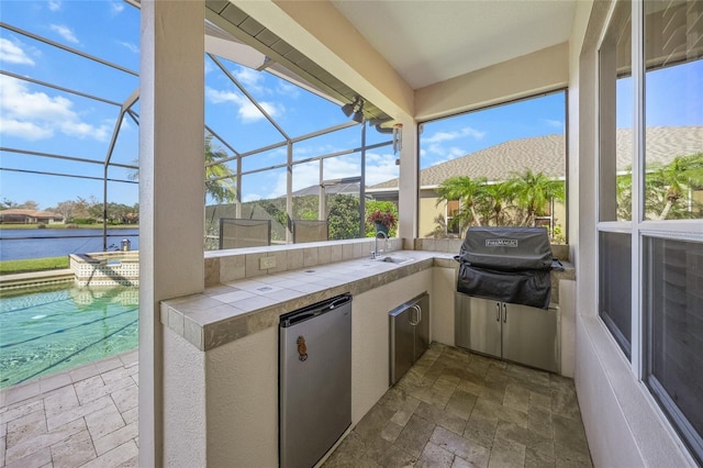 unfurnished sunroom with plenty of natural light and a water view