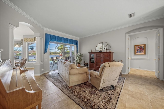 living room featuring ornate columns and ornamental molding