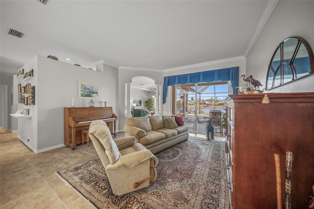 tiled living room with ornamental molding and decorative columns