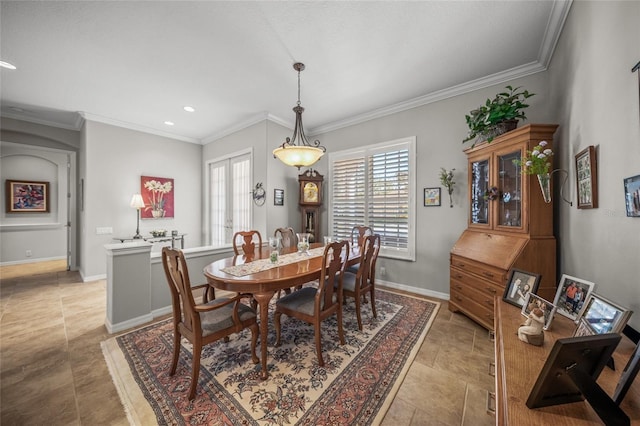 tiled dining area with ornamental molding and french doors