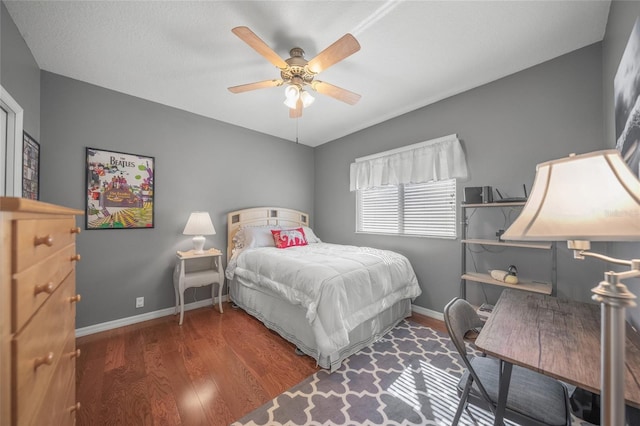 bedroom featuring dark hardwood / wood-style flooring and ceiling fan