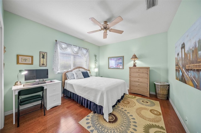 bedroom featuring hardwood / wood-style floors and ceiling fan