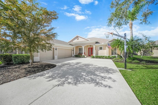 view of front facade with a garage and a front yard