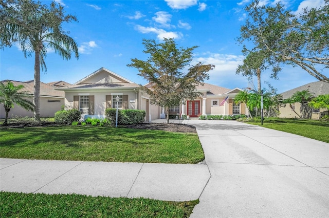 single story home featuring a front lawn