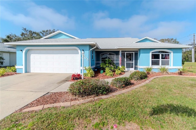 single story home with a garage and a front yard