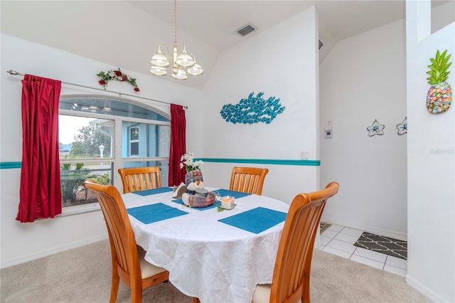 carpeted dining space with lofted ceiling and a chandelier