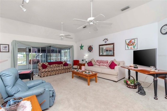 carpeted living room with lofted ceiling, a wealth of natural light, and ceiling fan