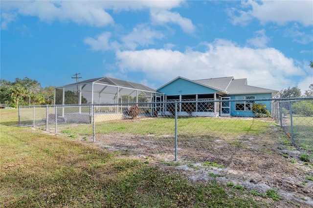 view of yard with glass enclosure