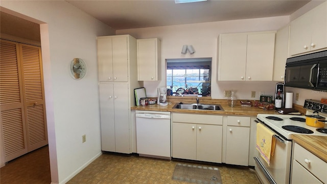 kitchen with white appliances, sink, and white cabinets