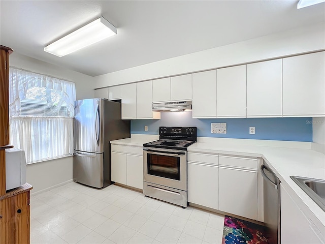 kitchen with white cabinets and appliances with stainless steel finishes