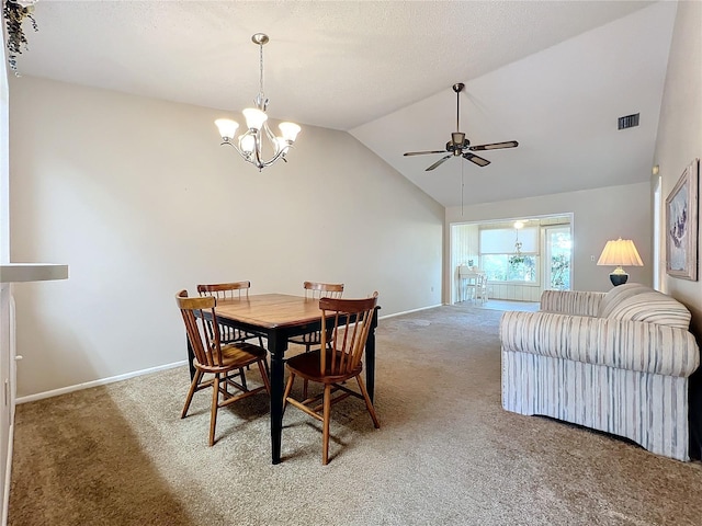 dining room featuring vaulted ceiling, carpet floors, and ceiling fan with notable chandelier