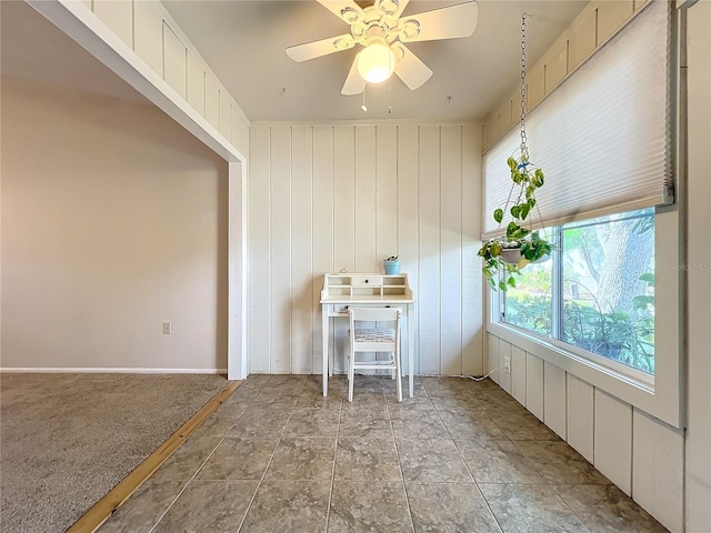 interior space featuring ceiling fan