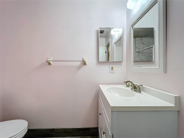 bathroom with vanity and toilet