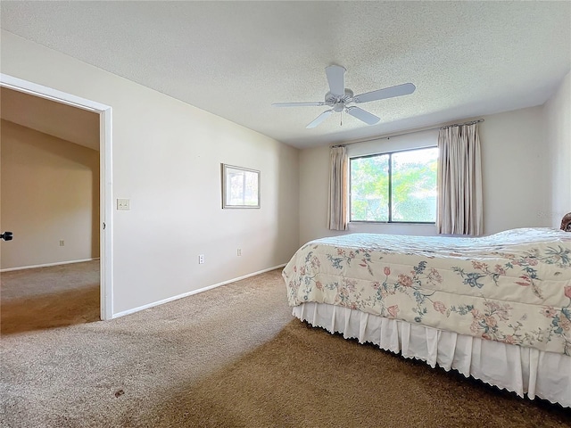 bedroom featuring a textured ceiling, ceiling fan, and carpet flooring