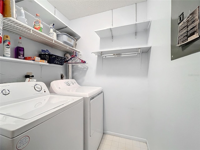 laundry area featuring washer and dryer and a textured ceiling