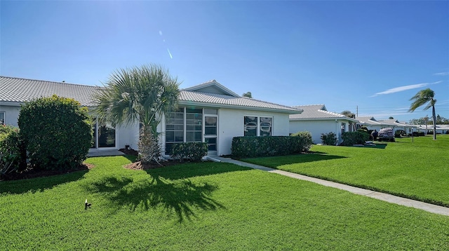 single story home with a front yard