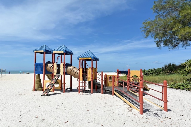 view of play area featuring a water view and a view of the beach