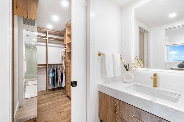 bathroom featuring vanity and hardwood / wood-style floors