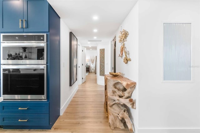 hallway with light wood-type flooring