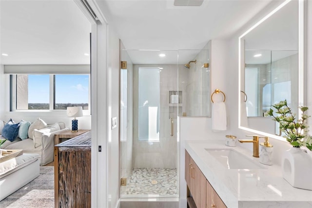 bathroom with vanity and walk in shower