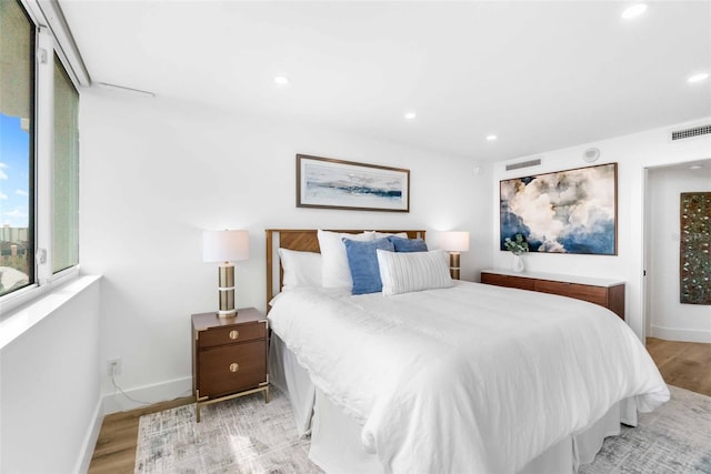 bedroom with light wood-type flooring