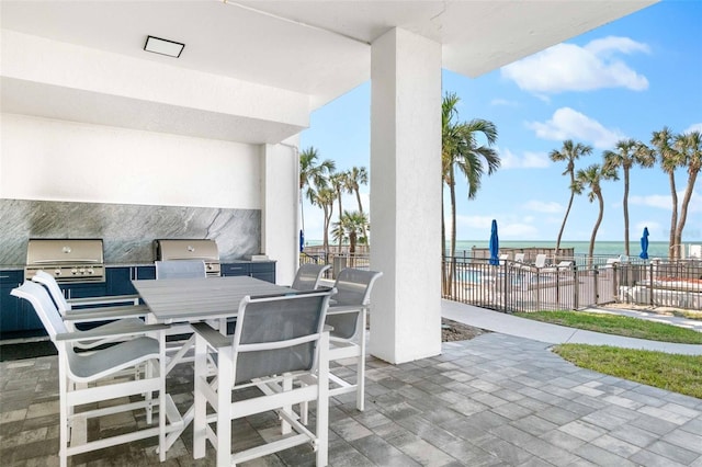 view of patio / terrace featuring a water view, grilling area, and area for grilling