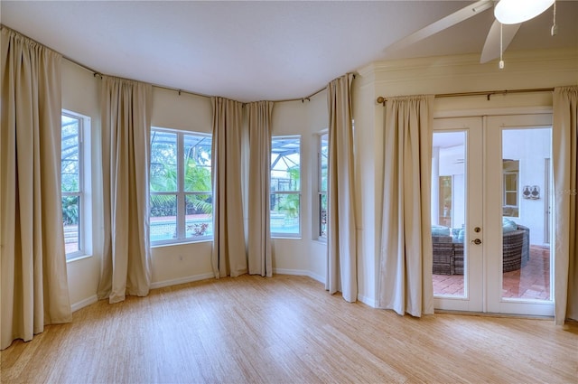 unfurnished room featuring light hardwood / wood-style flooring and french doors