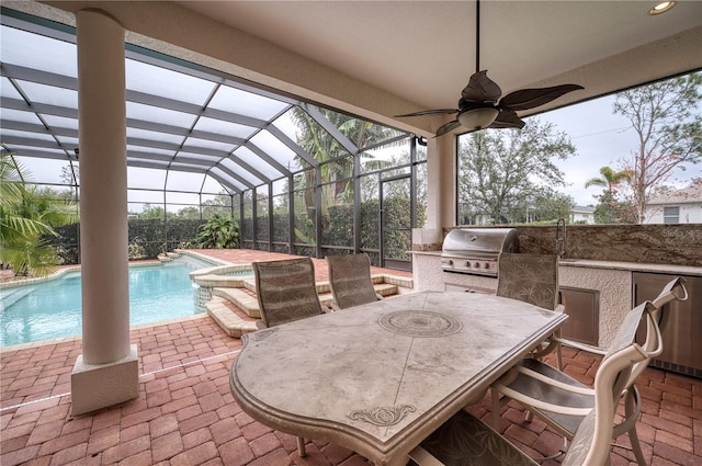 view of patio / terrace with exterior kitchen, area for grilling, and a pool with hot tub